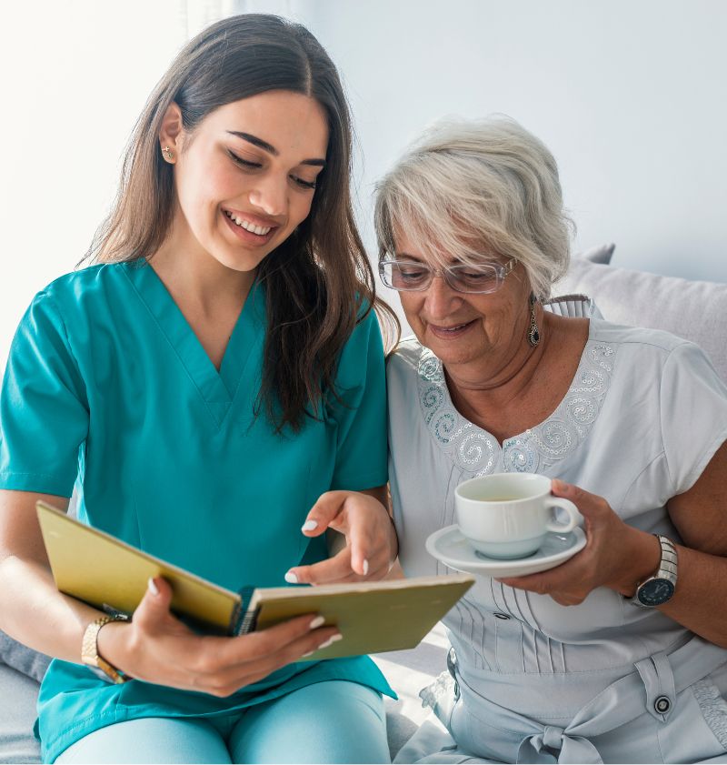 Image of caregiver and senior resting at home Image of caregiver and senior resting at home